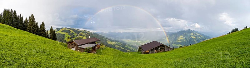 Alpine huts, view over the Brixen Valley with rainbow, Hochbrixen, Brixen im Thale, Kitzbühel Alps, Tyrol, Austria, Europe