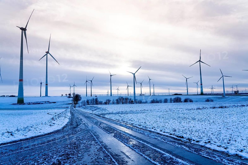 Wind farm, north of Lichtenau, self-proclaimed energy town, over 190 wind turbines and over 1200 solar panels generate 10 times as much electricity as the community of 11, 900 inhabitants consumes, largest onshore cluster of wind turbines in Germany, winter, slightly snow-covered landscape, North Rhine-Westphalia, Germany, Europe