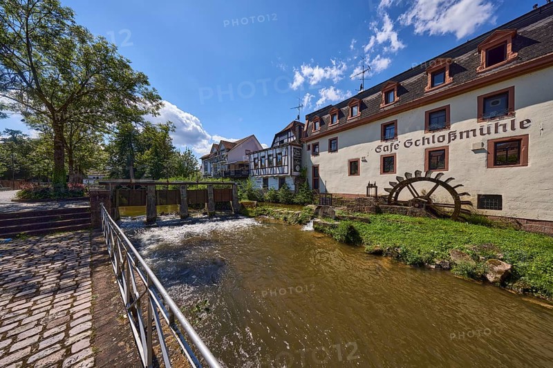 Castle mill, river Mümling, watermill, half-timbered house, historical building, metal railing, weir, trees, cobblestone pavement, backlight, Lustgartenstraße, Erbach, Odenwald, Odenwaldkreis, Hesse, Germany, Europe