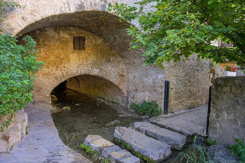 Stepping stones over a water channel, Saint-Guilhem-le-Désert, Département Hérault, France, Europe