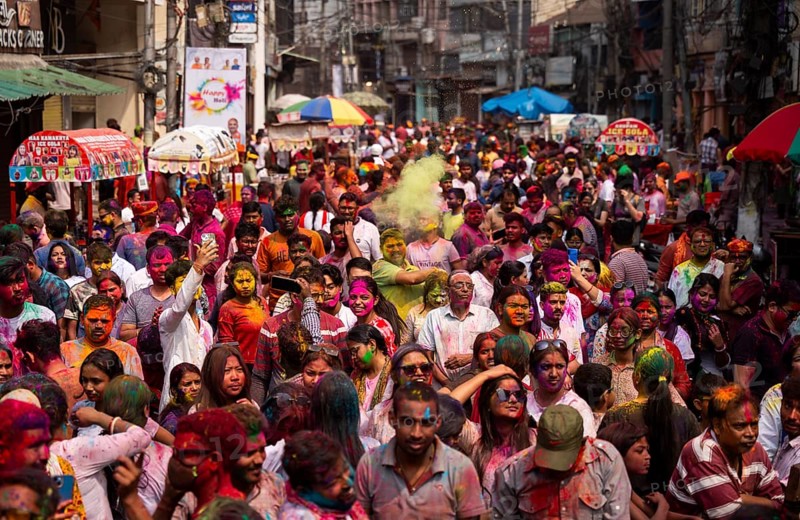 Revellers smear with Gulal or coloured powder and dance to play Holi, the Hindu spring festival of colours, on March 14, 2025 in Guwahati, India, Asia