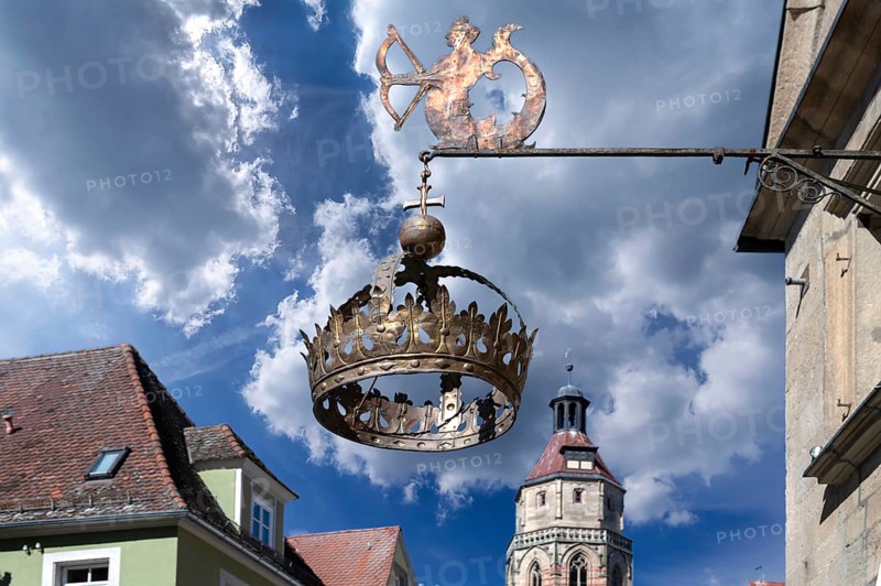 Nose sign of the Hotel Restaurant Krone, 15th century, Rosenstraße 10, behind the tower of the parish church of St Andrew, Weißenburg, Middle Franconia, Bavaria, Germany, Europe
