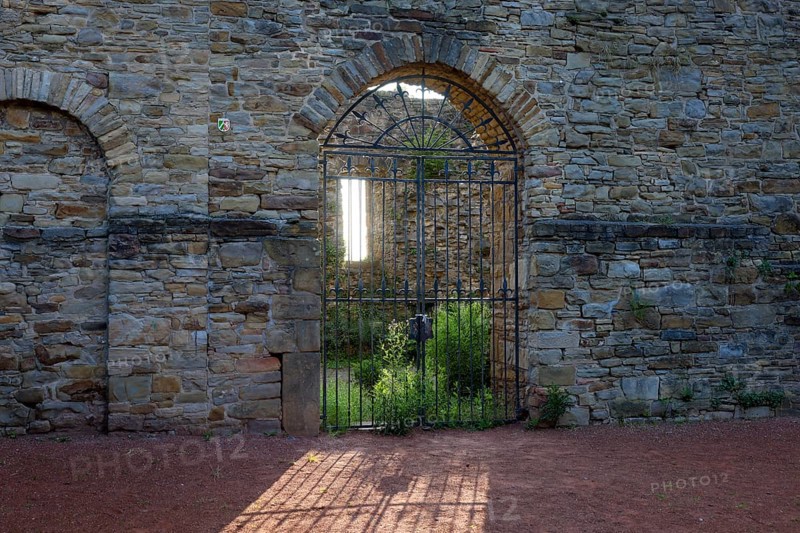 Wetter an der Ruhr, North Rhine-Westphalia, Germany - Wetter Castle in the historic old town centre of Wetter an der Ruhr. Entrance gate backlit