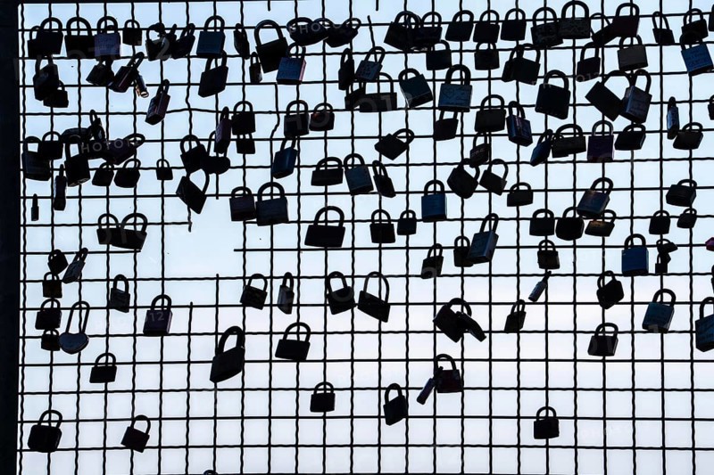 Padlocks, so-called love locks on a fence, vantage point in Wesel am Rhein, North Rhine-Westphalia, Germany, Europe