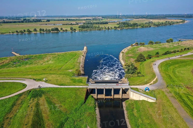 Dinslaken, North Rhine-Westphalia, Germany - Drop structure at the mouth of the Emscher into the Rhine. The mouth of the Emscher into the Rhine is being moved almost 500 metres north from Dinslaken to Voerde. Fish will then be able to swim barrier-free up the new Emscher from the Rhine through a newly created floodplain area. Following the construction of a parallel sewer, the Emscher has been completely free of sewage since January 2022. The river was previously an open, above-ground combined sewer with rainwater and wastewater