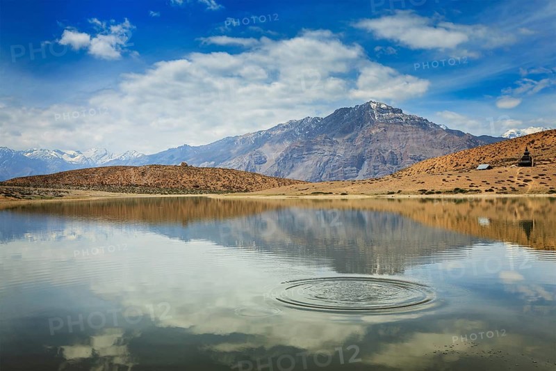 Himalayas mountains refelcting in mountain lake Dhankar Lake. Spiti Valley, Himachal Pradesh, India, Asia