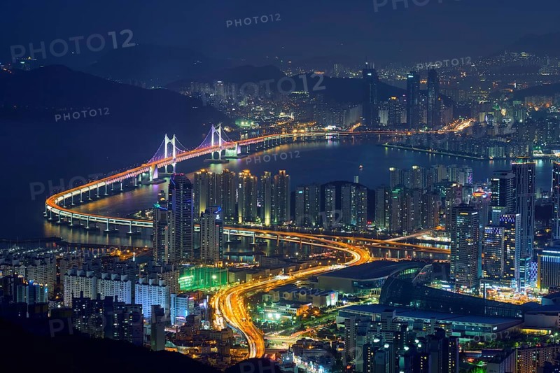 Busan cityscape with skyscrapers and Gwangan Bridge illuminated at night. Busan. South Korea