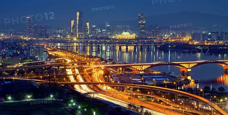 Aerial panorama of Seoul downtown cityscape and Seongsan bridge over Han River in twilight. Seoul, South Korea, Asia