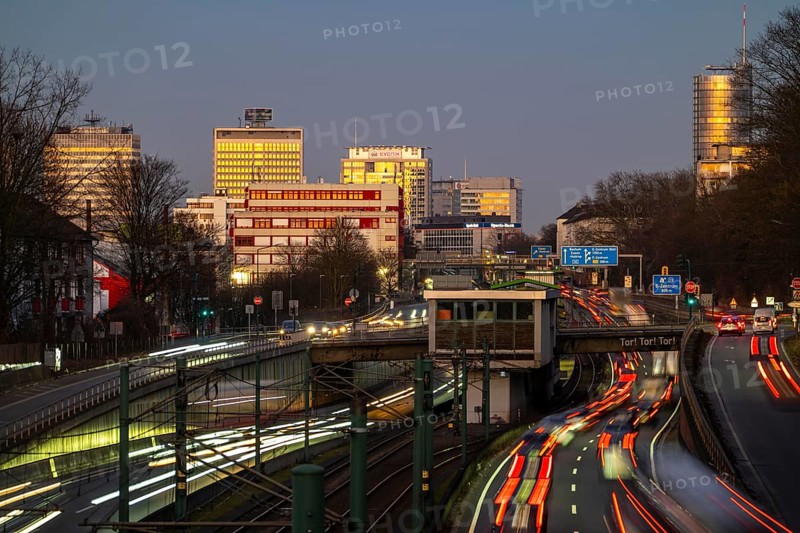 Motorway A40, Ruhr expressway, heavy traffic jam, rush hour, city passage in Essen, skyline of the city centre, underground line between the lanes, Hobeisenbrücke stop, North Rhine-Westphalia, Germany, Europe