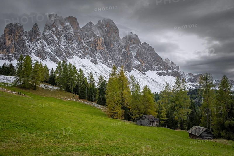 View of a part of the Geisler group in the foreground two mountain huts, Dolomites, snow, Puez-Geisler nature park Park, St. Magdalena, Villnöß, Funes, Villnößtal, South Tyrol, Italy, Europe