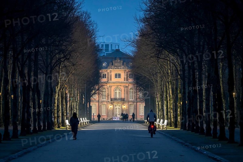 The light benches by artist Stefan Sous in the Hofgarten, entitled UV-A UV-B, 14 completely refurbished exhibits from the 2002 light-grey art exhibition, which now stand and light up as a permanent work of art on Jägerhofallee, LED technology, in the background Jägerhof Palace, home of the Goethe Museum, Düsseldorf, North Rhine-Westphalia, Germany, Europe