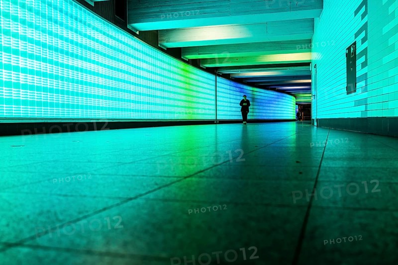 Passage under Essen's main railway station, connects entrances to the city and the main railway station, with the underground station, illuminated, LED wall, few people, Germany, Europe