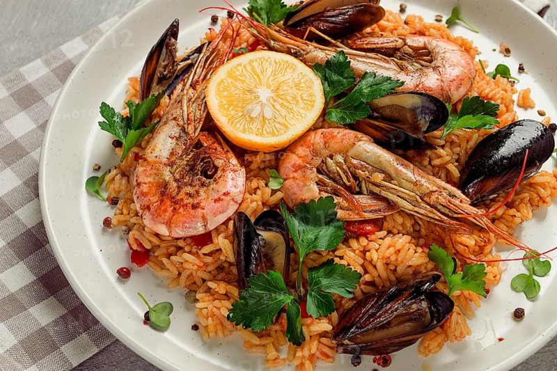 Seafood paella, shrimp and mussels risotto, rice, homemade, top view, no people