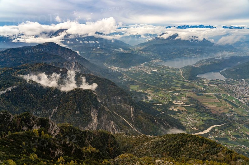 View from the summit of Mount Pizzo di Levico to the lakes in the Sugana Valley, Trentino, Italy, Europe
