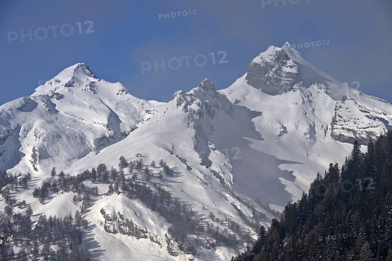 Snow-covered peaks of the Bernese Alps rise out of the fog, Bernese Alps, near Ovronnaz, Switzerland, Europe