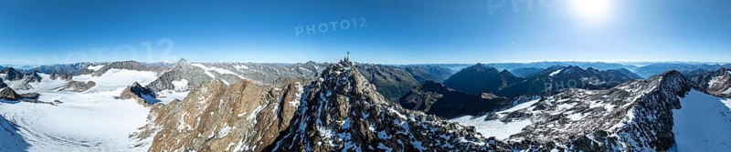 Panorama at the summit of the Wilder Freiger with summit cross and with glacier Übeltalferner and Wilder Freiger Ferner, picturesque mountain landscape, aerial view, Stubai Alps, South Tyrol, Italy, Europe