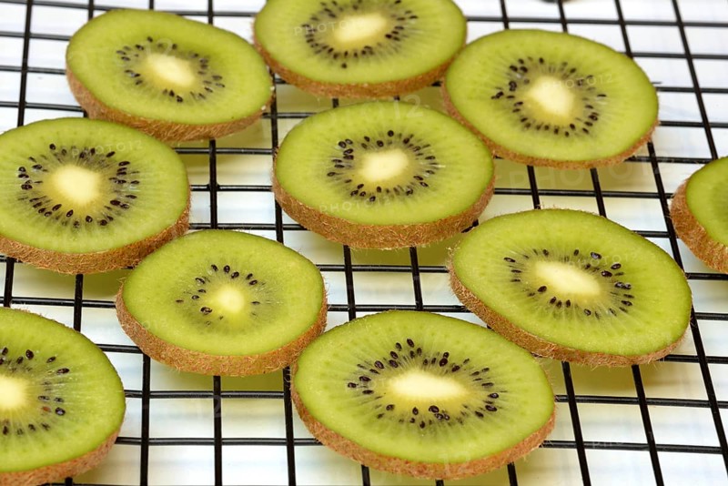 Kiwi slices laid out on a wire rack to dry, Actinidia deliciosa