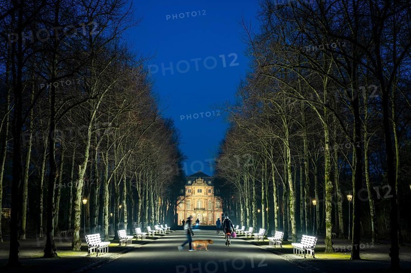 The light benches by artist Stefan Sous in the Hofgarten, entitled UV-A UV-B, 14 completely refurbished exhibits from the 2002 light-grey art exhibition, which now stand and light up as a permanent work of art on Jägerhofallee, LED technology, in the background Jägerhof Palace, home of the Goethe Museum, Düsseldorf, North Rhine-Westphalia, Germany, Europe