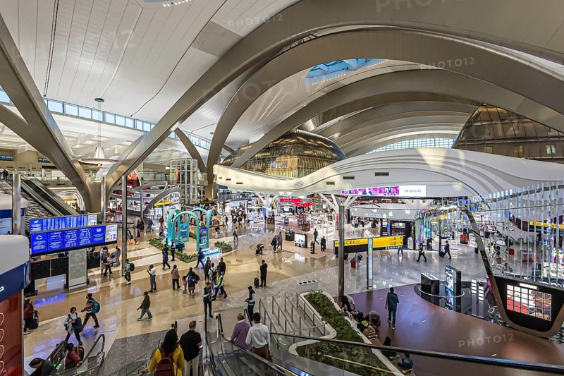 Abu Dhabi Airport, Zayed International Airport with passengers. The new Terminal A has a capacity of 45 million passengers per year. Modern architecture. Abu Dhabi, United Arab Emirates, UAE, Asia