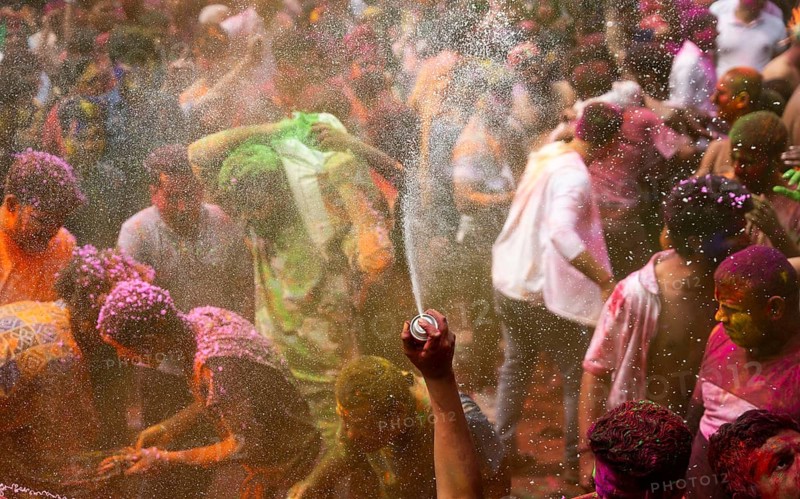 Revellers smear with Gulal or coloured powder and dance to play Holi, the Hindu spring festival of colours, on March 14, 2025 in Guwahati, India, Asia