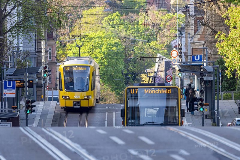 Bus and light rail over hill and dale. Public transport in Stuttgart at Eugensplatz. Stuttgart, Baden-Württemberg, Germany, Europe