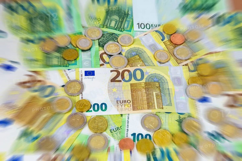 Close-up of euro banknotes and euro coins