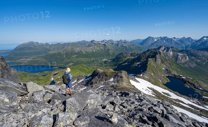 View of mountains and fjord landscape, mountain panorama, mountaineer at the summit of Rundfjellet, lake Hellskarvatnet, Svolvaer, Nordland, Norway, Europe