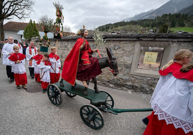 Altar servers preparing for the palm tree procession in the parish church of the Assumption of the Virgin Mary, Thaur, district of Innsbruck, Tyrol, Austria, Europe