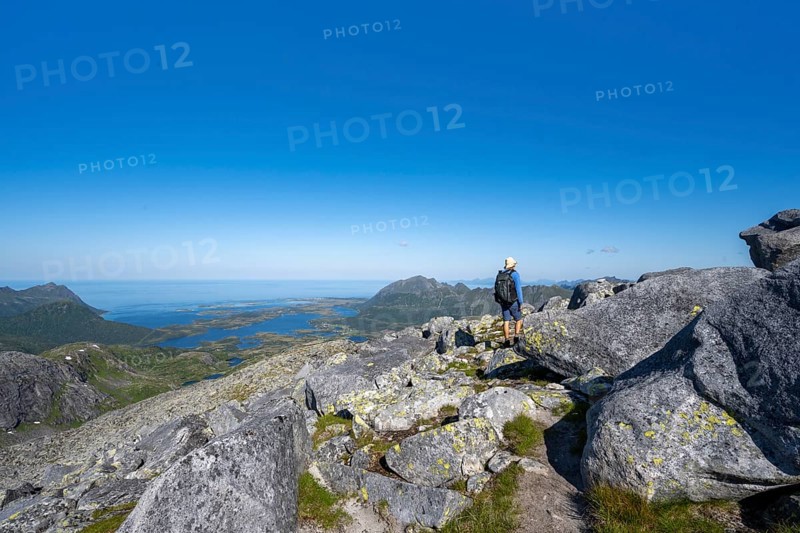 View of mountains and fjord landscape, mountain panorama, mountaineer at the summit of Rundfjellet, Svolvaer, Nordland, Norway, Europe