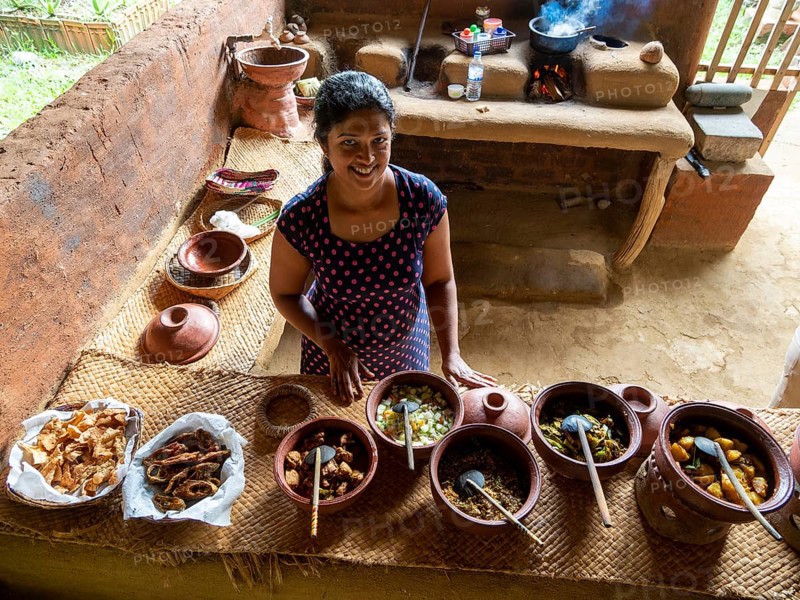 Sinhala woman prepares lunch in clay pots, Sri Lanka, Asia