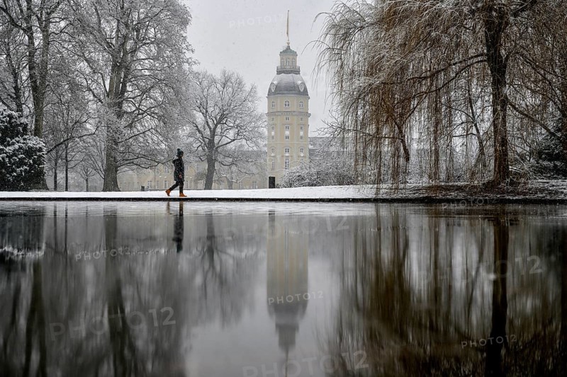 Karlsruhe castle reflected in a pond in the castle garden, Karlsruhe, Baden-Württemberg, Germany, Europe