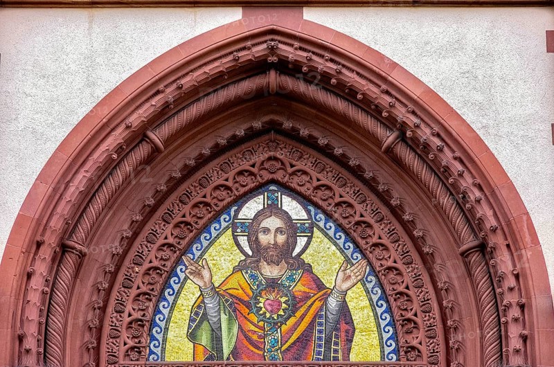 Musical depiction of Jesus Christ in the pointed arch of the main portal of the Church of the Sacred Heart in Freiburg im Breisgau, Baden-Württemberg, Germany, Europe