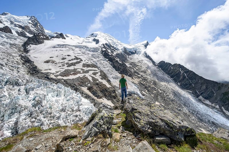 Mountaineers on the glacier, High alpine glaciated mountain landscape, La Jonction, Glacier des Bossons meets Glacier de Taconnaz, Summit of Mont Maudit and Mont Blanc, Chamonix, Haute-Savoie, France, Europe