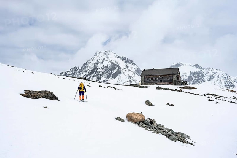 Ski tourer in the mountains in winter, Piz Bever, Chamanna Jenatsch CAS, Swiss Alpine Club hut, Val Beve, Graubünden, Switzerland, Europe
