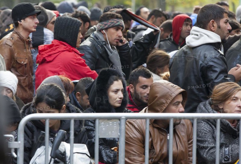 Refugees from Syria waiting to be registered at the Central Reception Centre for Asylum Seekers at the Berlin State Office for Health and Social Affairs, 09.10.2015