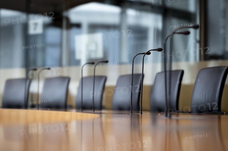 Microphones and seats in a hearing room in the Marie-Elisabeth-Lüders-Haus