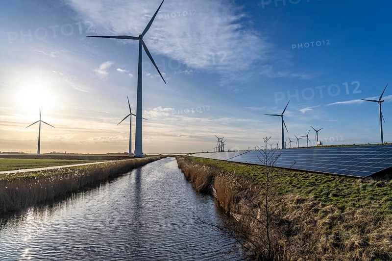 Solar park on the Slaperdijk dyke near the Eemshaven, test project, 17, 000 solar modules were installed over a good 5 kilometres, the Netherlands has over 22, 000 kilometres of dyke line, here it is being tested whether such an installation is successful and can be expanded, wind farm, Groningen, Netherlands