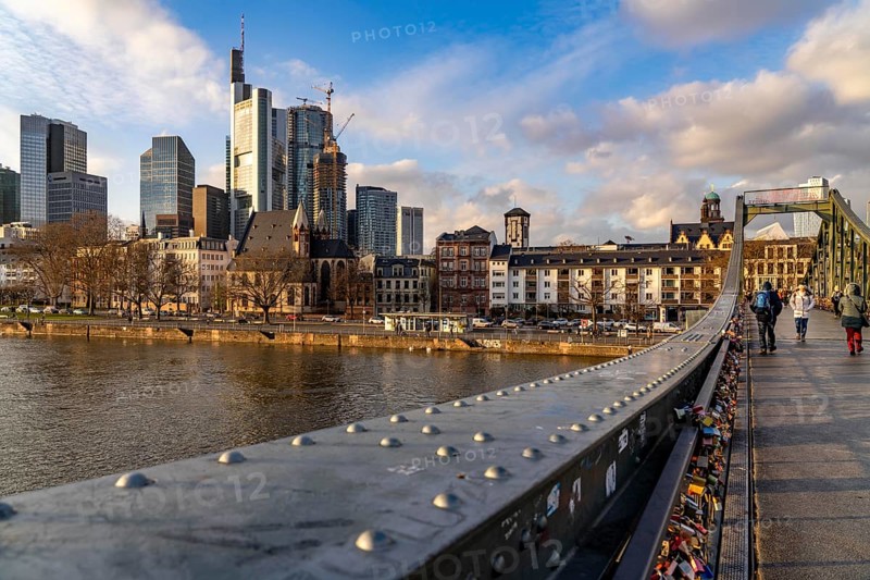 Skyline of the city centre of Frankfurt am Main, river Main, Eiserner Steg bridge, dusk, Hesse, Germany, Europe
