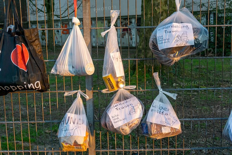 Gift fence with donations for the homeless and needy, food, hygiene articles, clothing, in Essen Rüttenscheid, effects of the corona crisis in Germany