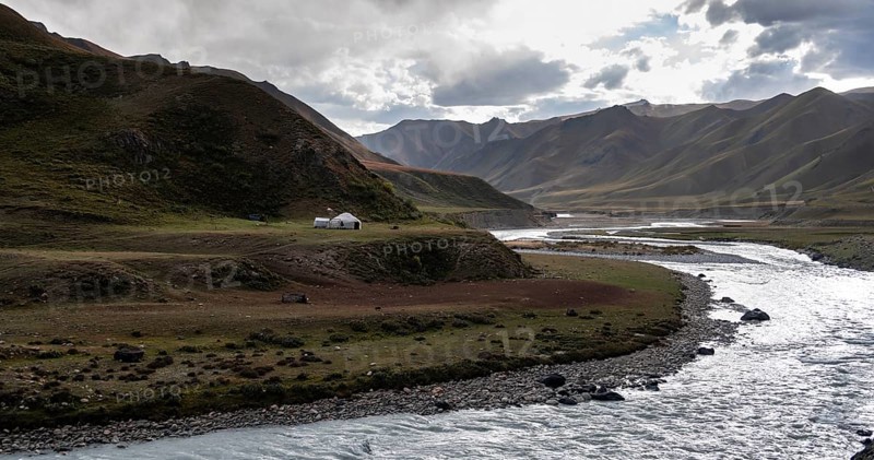 Yurt by a river, Desolate mountain landscape, Tian Shan, Sky Mountains, Sary Jaz Valley, Kyrgyzstan, Asia