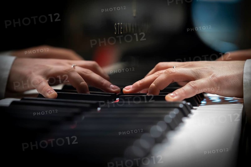Hands of a young pianist playing on the keyboard of a Steinway & Sons grand piano, Stuttgart, Baden-Württemberg