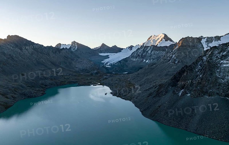 Mountain panorama, aerial view, 4000 metre peak with glacier, mountain pass and mountain lake Ala-Kul Lake, Tien Shan, Kyrgyzstan, Asia