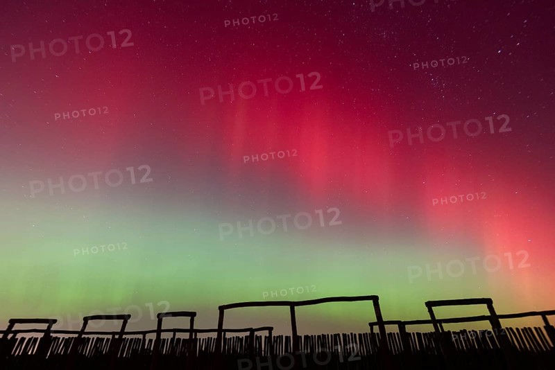 Northern lights (aurora borealis) over the ring sanctuary of Pömmelte, prehistoric circular ditch complex, also known by archaeologists as the German Stonehenge, Pömmelte, Saxony-Anhalt, Germany, Europe