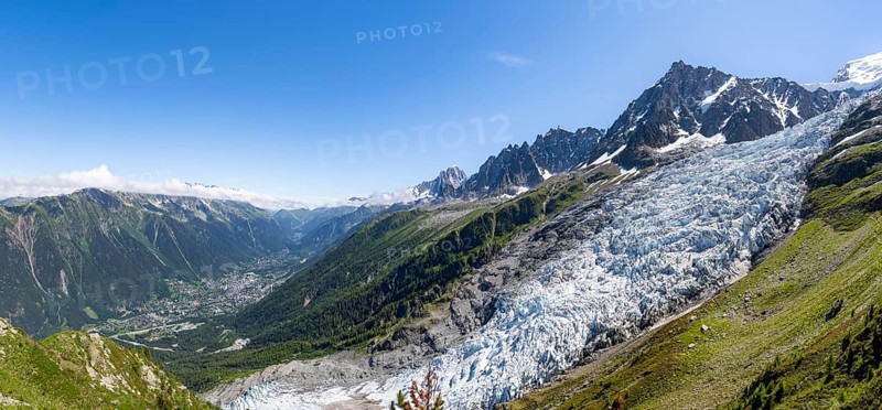 Panorama, mountain landscape with glacier Glacier des Bossons and summit of the Aiguille du Midi, view into the valley with the village of Chamonix, Chamonix, Haute-Savoie, France, Europe
