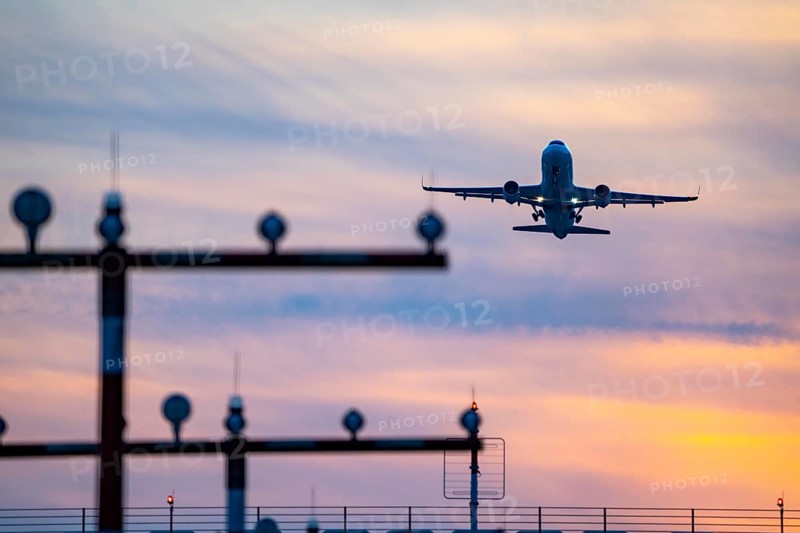 Runway lighting, approach aids, at Düsseldorf International Airport, sunset, aircraft taking off from the main runway south, 05R/23L, North Rhine-Westphalia, Germany, Europe