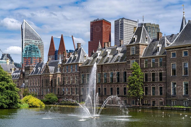 The historic Binnenhof, seat of the Dutch government, Hofvijver pond, skyline of the city centre at the central station, in the city centre of The Hague, Netherlands