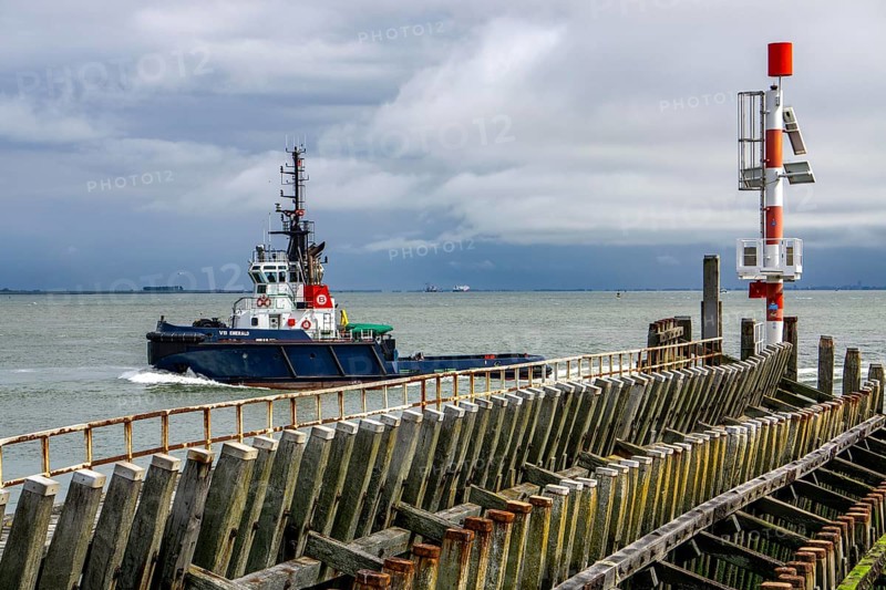 Harbour tug VB Emerald in the Western Scheldt, entering the harbour of Vlissingen, Zeeland, Netherlands