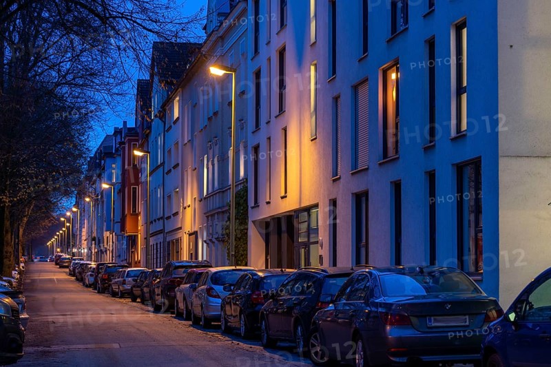 Residential street, many apartment buildings in a residential neighbourhood, evening, lantern lighting, Essen, North Rhine-Westphalia, Germany, Europe