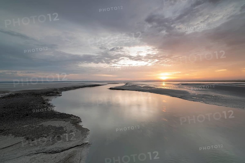 Sunrise off the monastery island of Mont Saint Michel in the Wadden Sea, Le Mont Saint Michel, Normandy, France, Europe