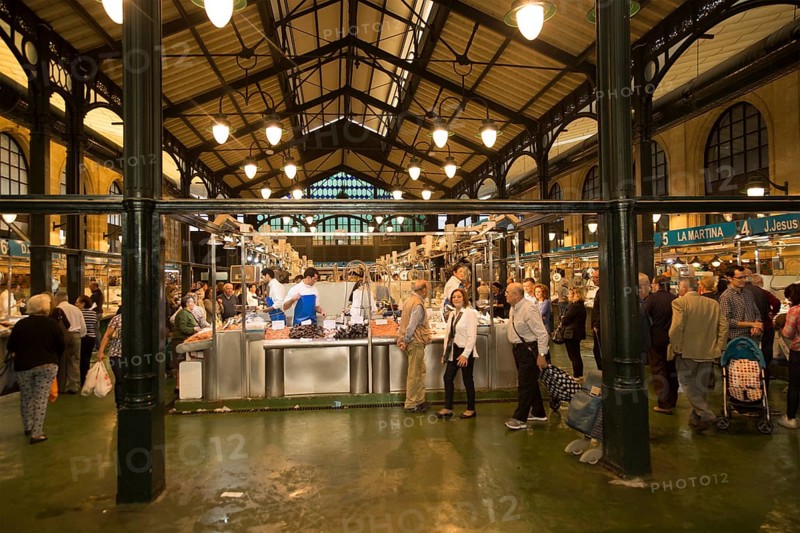People shopping at fishmonger stalls inside historic covered market building, Jerez de la Frontera, Spain, Europe